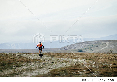 mountainbiker on cycle rides on a mountain trail 25873556