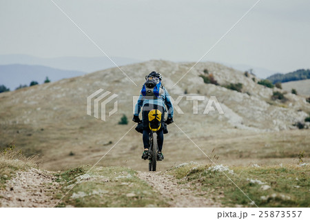 male tourist-traveler on cycle 25873557