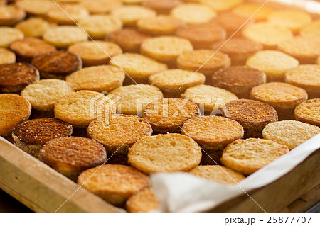 Rows of biscuits under sunlight. 25877707