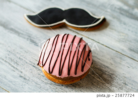 Glazed biscuits on wooden surface. Glazed biscuits on wooden surface. 25877724