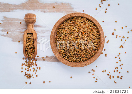Raw organic bee pollen on shabby wooden . 25882722