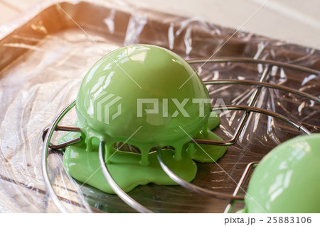 Dessert covered in liquid glaze. 25883106