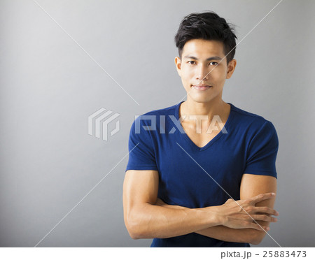smiling muscular asian young man smiling muscular asian young man 25883473