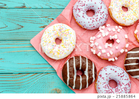 Donuts on colorful wooden background Donuts on colorful wooden background 25885864