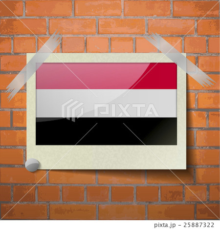 Flags Yemen scotch taped to a red brick wall 25887322