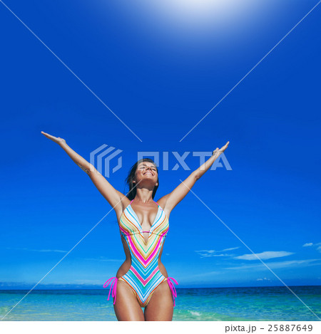 Happy woman on beach Happy woman on beach 25887649