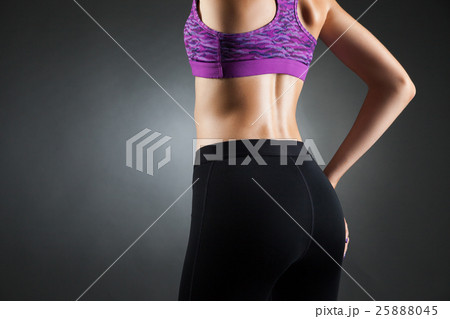 Sportswoman's buttocks back view. 25888045