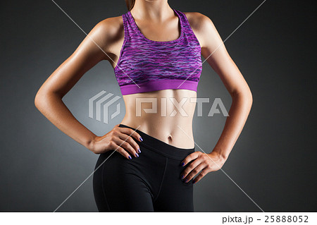 Fit anonymous girl akimbo. 25888052