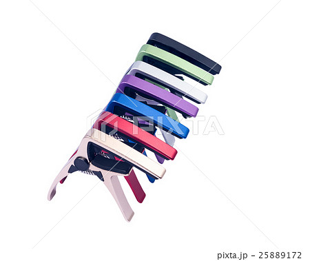 Guitar colorful capo on white background Guitar colorful capo on white background 25889172