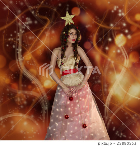 Girl dressed like christmas tree 25890553