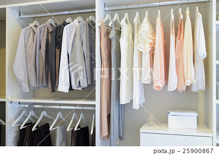 white dress and shirts hanging in white wardrobe white dress and shirts hanging in white wardrobe 25900867