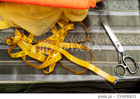 Sewing textile or cloth. Work table of a tailor. 25908835