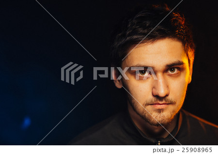 portrait of a young brutal man on black background portrait of a young brutal man on black background 25908965