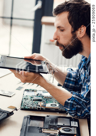 Engineer blow the dust off digital screen Engineer blow the dust off digital screen 25909069