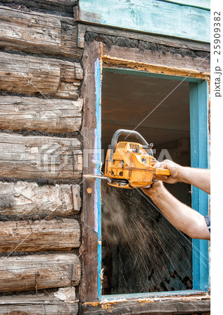 man sawing a window man sawing a window 25909382