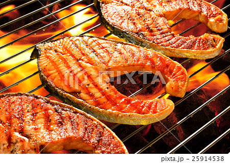 Grilled salmon on the flaming grill Grilled salmon on the flaming grill 25914538