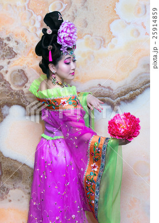 geisha dancing with flower against marble wall geisha dancing with flower against marble wall 25914859