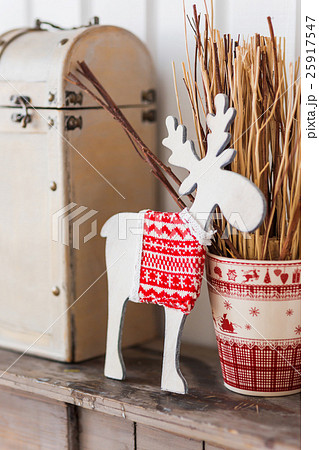 wooden deer in knitted sweater with nordic pattern 25917547