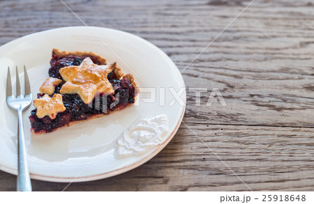 Portion of mince pie on the wooden background 25918648