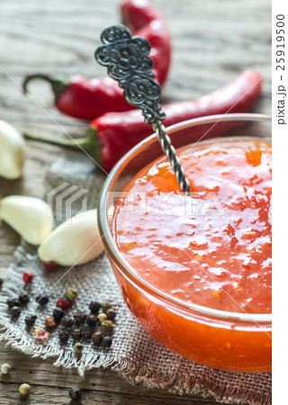 Glass bowl of thai sweet chili sauce Glass bowl of thai sweet chili sauce 25919500