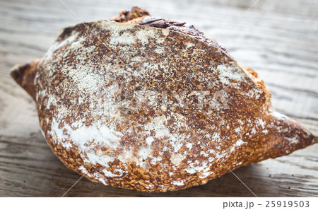 Wholegrain bread on the wooden background 25919503