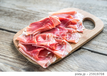 Slices of jamon on the wooden board 25919708