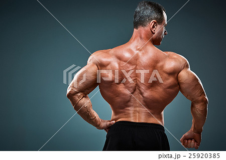 torso of attractive male body builder on gray torso of attractive male body builder on gray 25920385