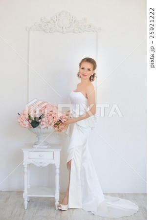 Girl in white dress in the apartment Girl in white dress in the apartment 25921222