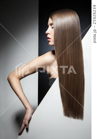 Close-up of model with perfect shining long hair Close-up of model with perfect shining long hair 25926239