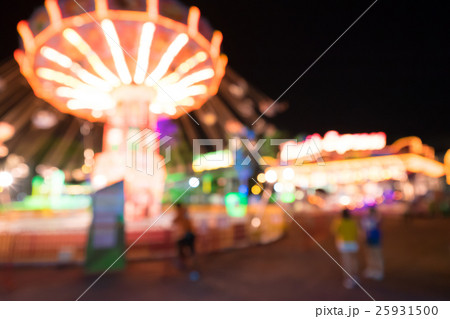 Blurred amusement park at night 25931500