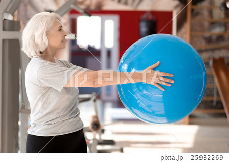 Smiling happy pleasant woman doing exercises with 25932269