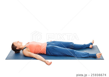 Women relaxes in yoga asana Savasana 25936674