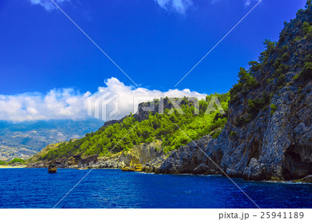Rocky seashore with ships 25941189