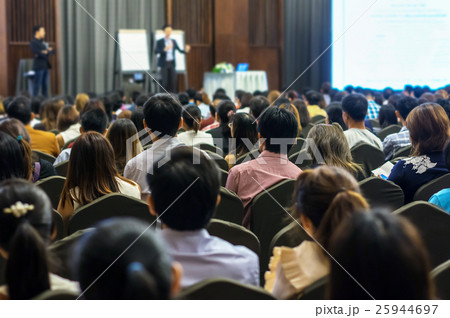 Speaker on the stage with Rear view of Audience in the conference hall or seminar meeting, business and education concept Speaker on the stage with Rear view of Audience in the conference hall or seminar meeting, business and education concept 25944697