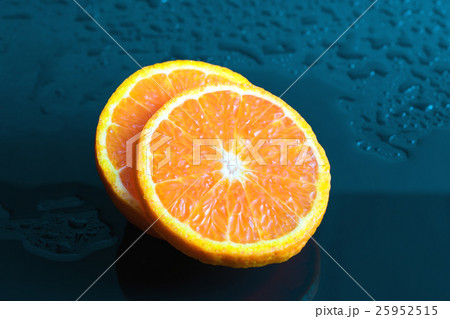 Still life Orange slice fruit on dark blue 25952515