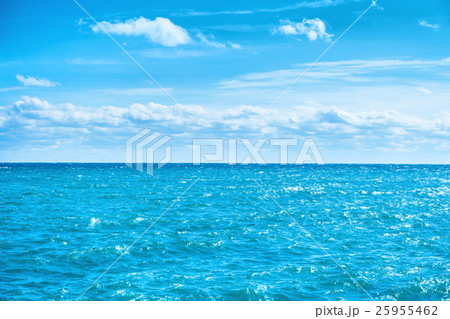 Sea water and blue sky with white clouds Sea water and blue sky with white clouds 25955462