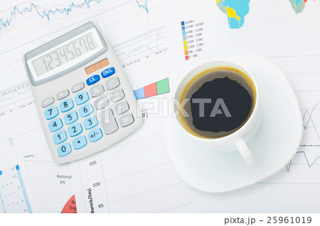 Calculator and cup of coffee 25961019