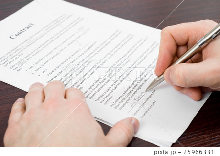 Some business documents signed on a table 25966331