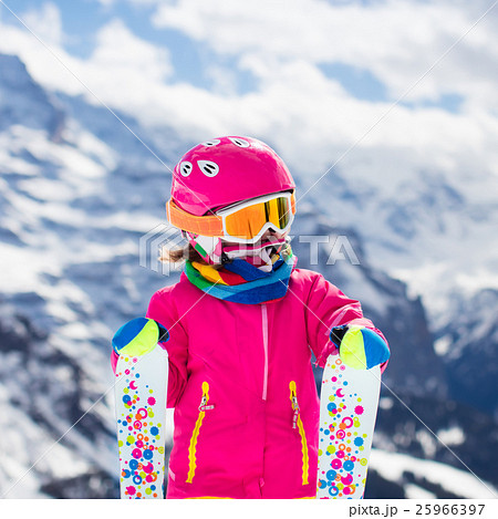 Little child skiing in the mountains 25966397