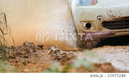 Rally car in muddy road 25975286