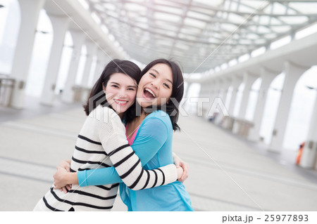 two beauty woman hug together two beauty woman hug together 25977893