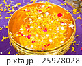 Water in bowl mixed with perfume and  flowers 25978028