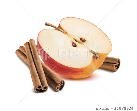 Red apple half and cinnamon sticks isolated 25978924