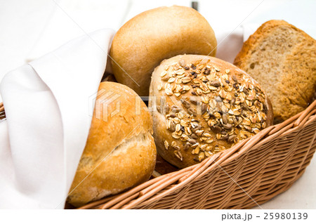 Wicker basket of freshly baked dinner rolls Wicker basket of freshly baked dinner rolls 25980139