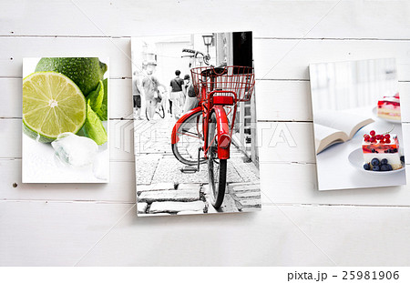 Three images on white wooden wall 25981906