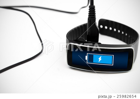 Smart watch charging with micro USB cable. 25982654