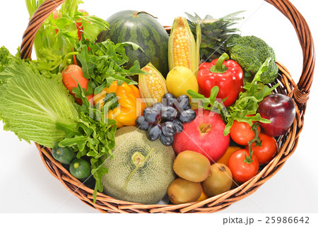 Fruits and vegetables in basket isolated on white Fruits and vegetables in basket isolated on white 25986642