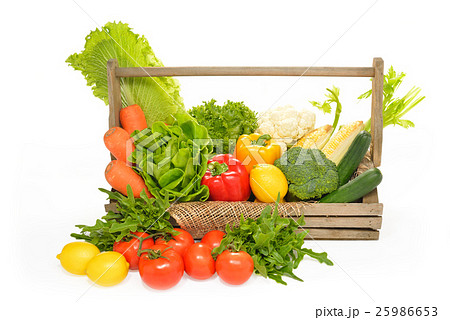 Fruits and vegetables in basket isolated on white Fruits and vegetables in basket isolated on white 25986653
