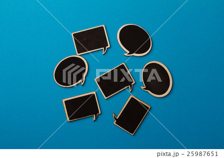 Chalkboard wooden speech bubbles on light blue Chalkboard wooden speech bubbles on light blue 25987651