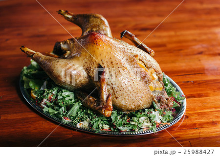 Duck on a tray with greens. 25988427